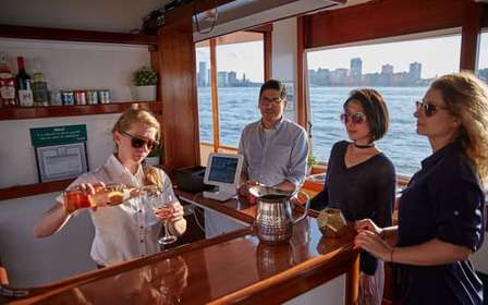 NYC: Sunset Cruise on a Small Yacht with a Drink